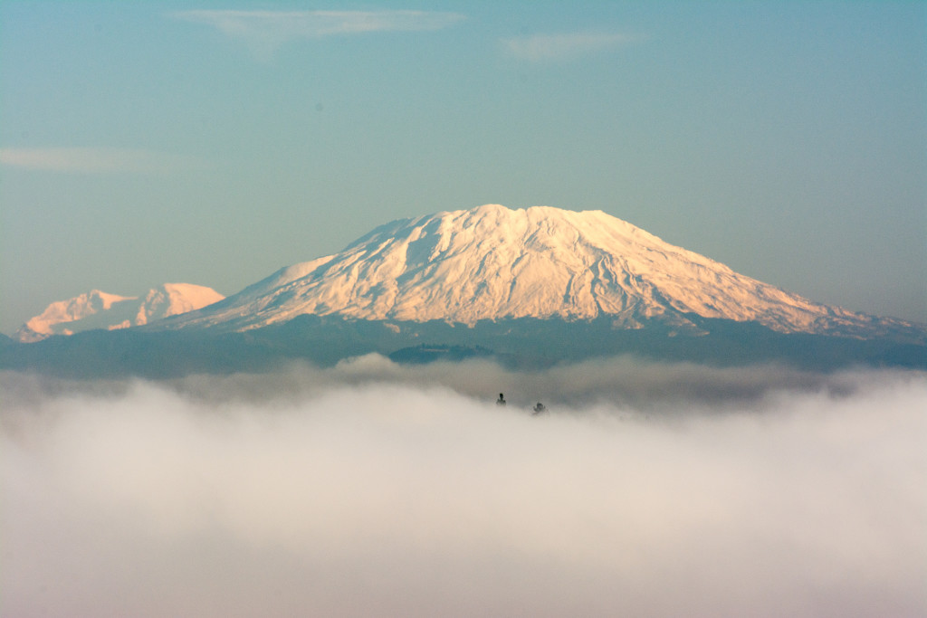 Mt St. Helens with Mt. Rainier behind on the left